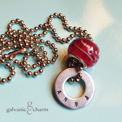 ANNA - Child's necklace with single hand-stamped washer. Cherry-colored glass bead. 16" stainless steel ball chain. $22 as shown. Available directly or on Etsy.